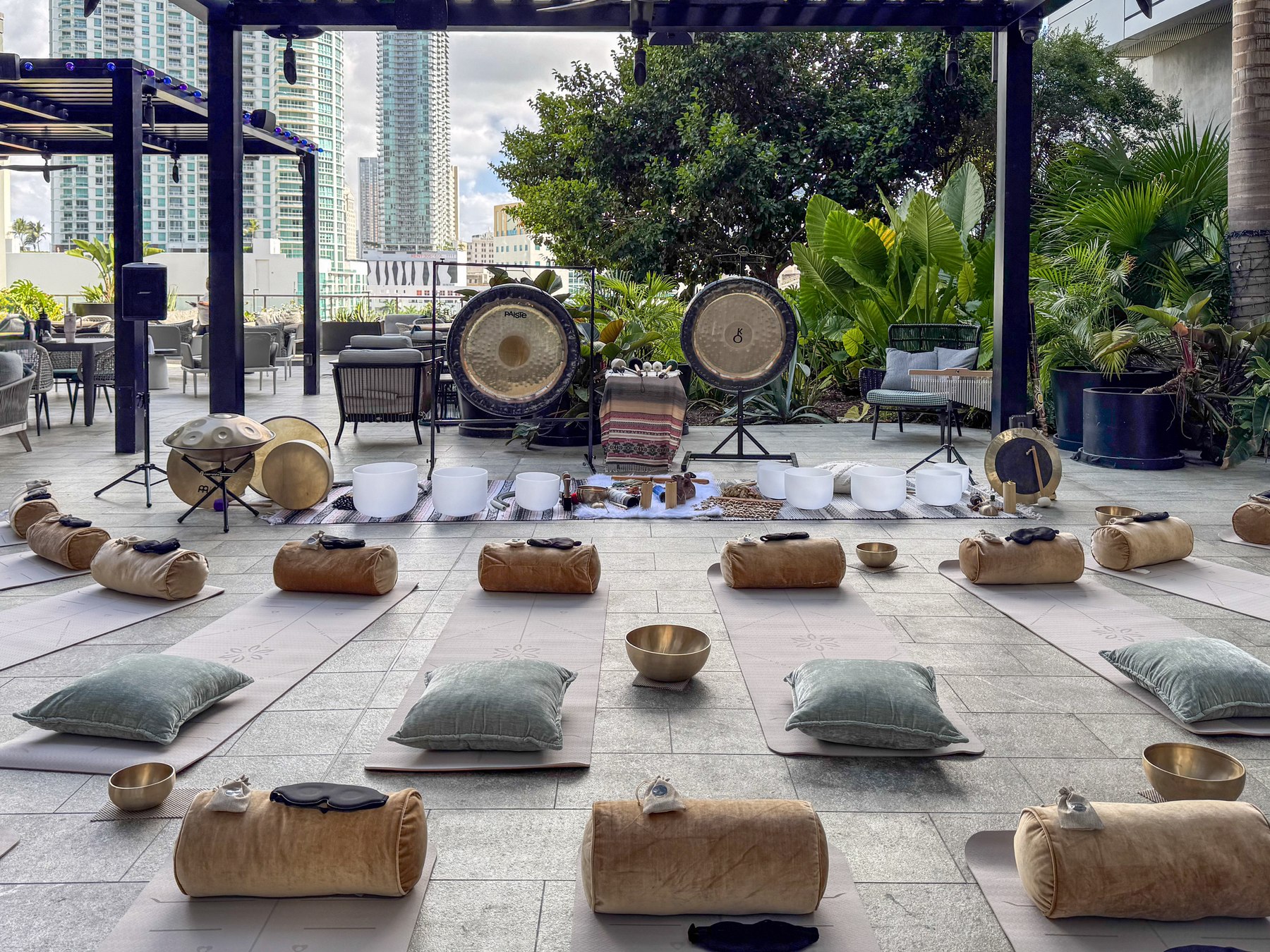 The terrace set with mats, bolsters and bowls before a ceremony